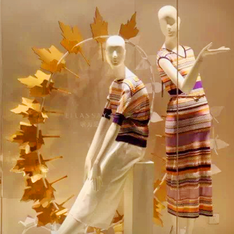 autumn leafs for female retail window display