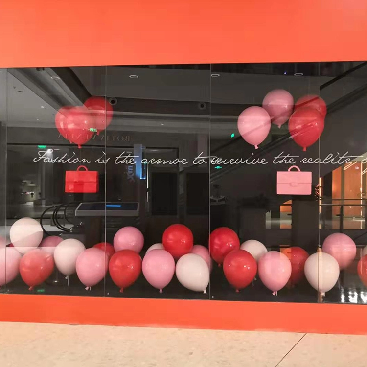 Hanging fiberglass balloons for retail store window display