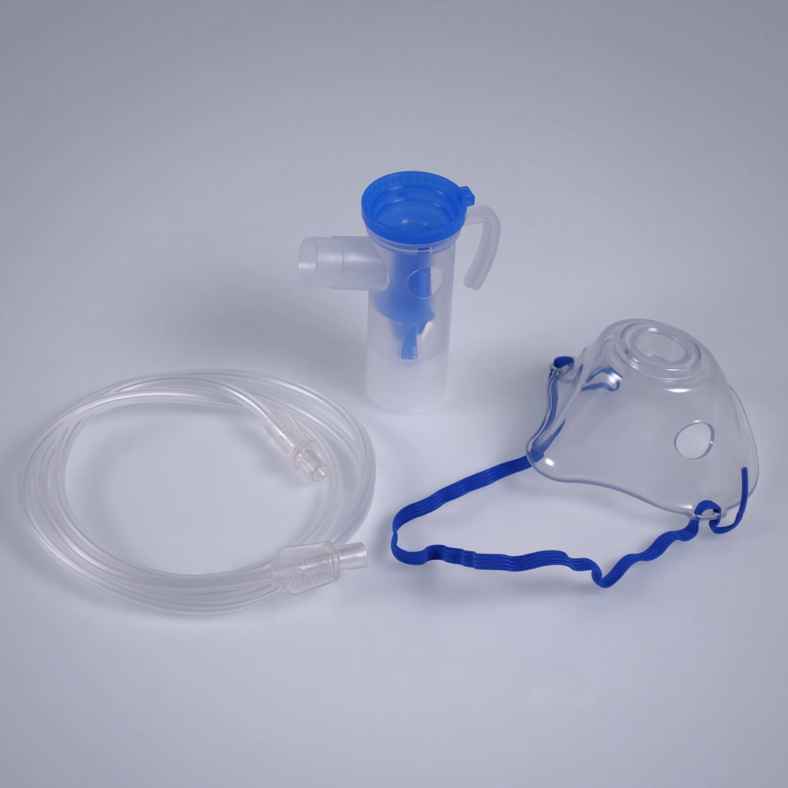 Disposable nebulizer cup with mask