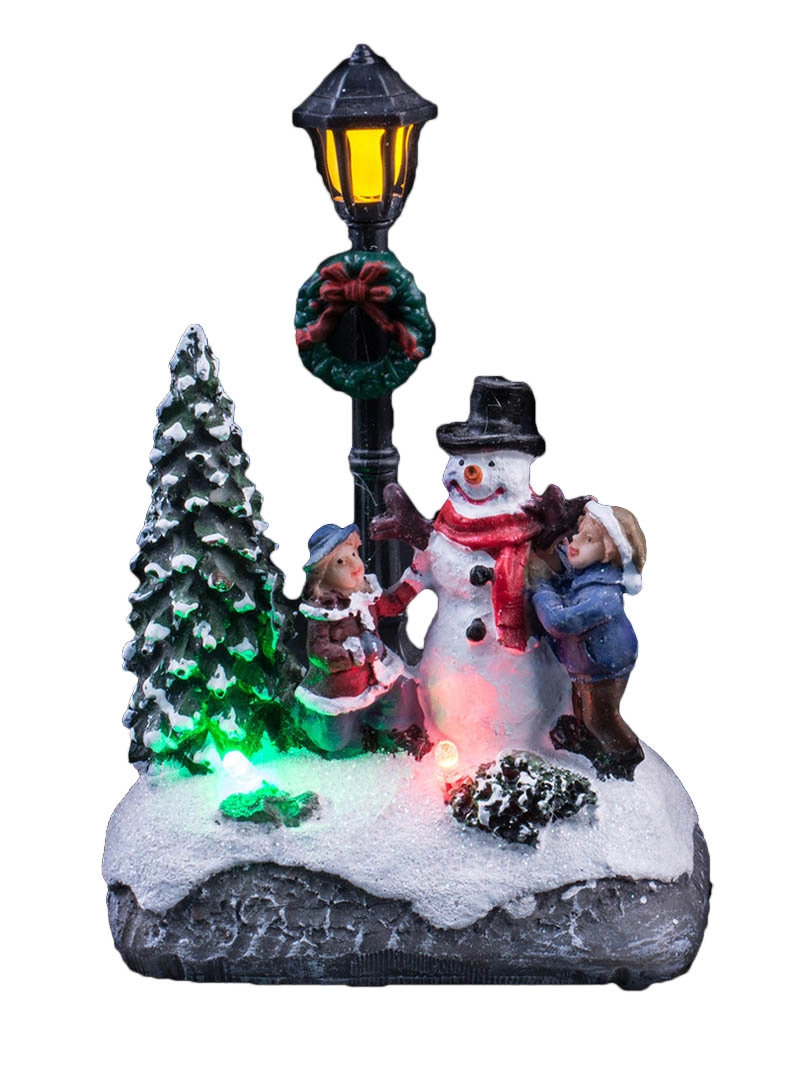 Lighted Up  Christmas Scene With Children Decorate The Snowman