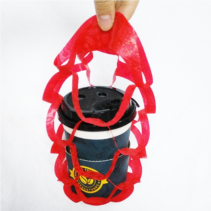 Folded nonwoven coffee cup holder