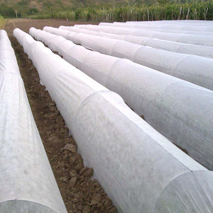 Nonwoven agricultural fabric ground cover