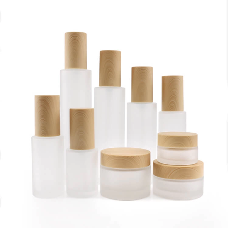 Frosted clear glass cosmetic bottle with bamboo lid