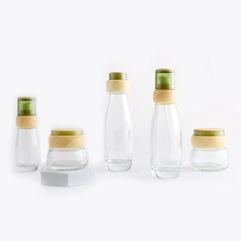 Clear cosmetic glass bottle set with bamboo lid