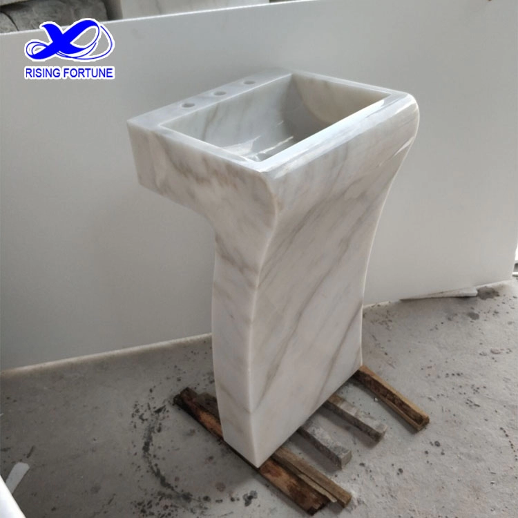 White marble pedestal bathroom basin
